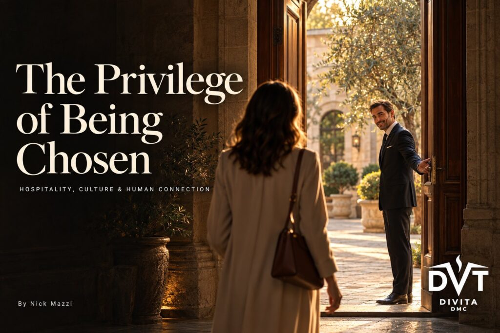 A host opens the door of a historic Italian palazzo to welcome a guest
